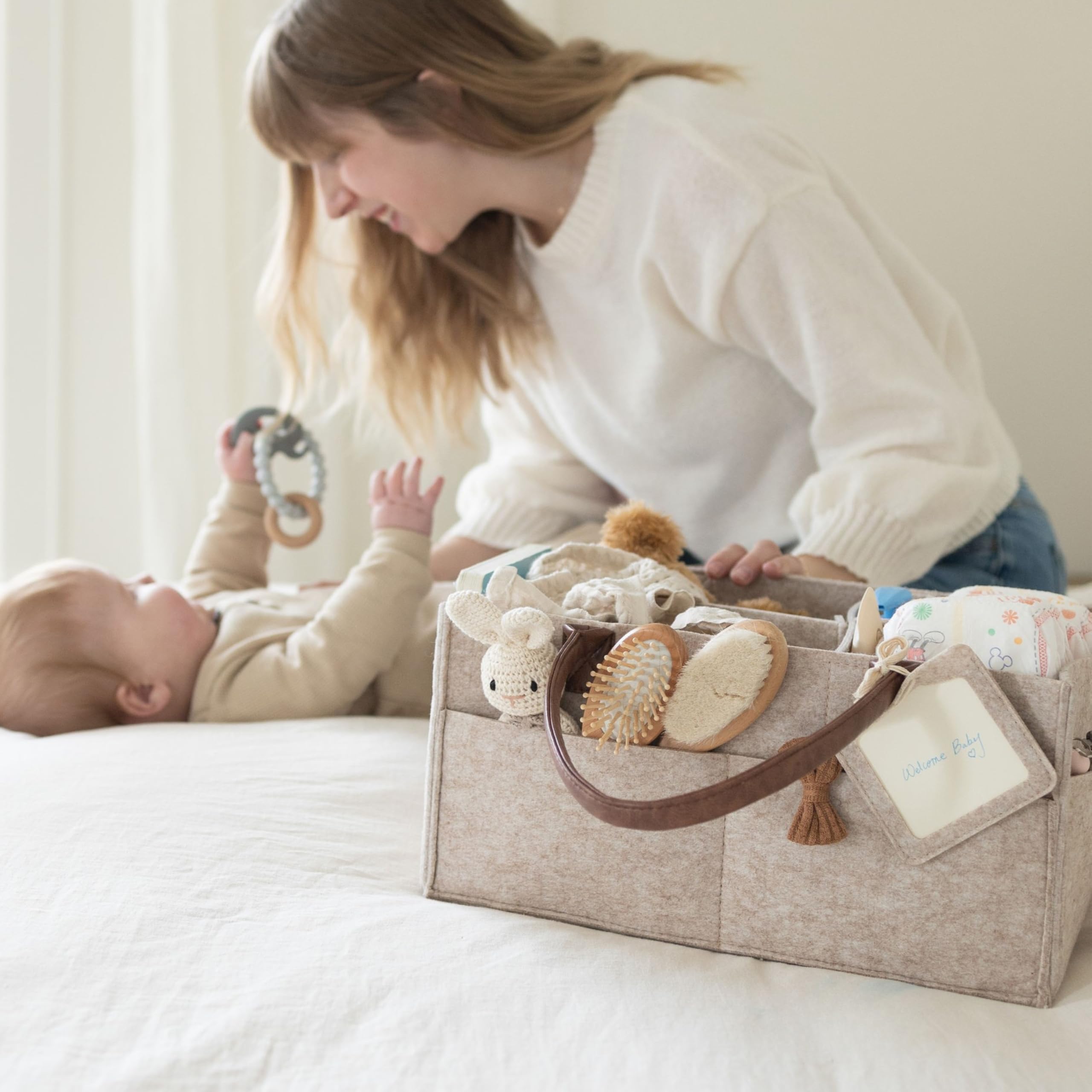 Lily Miles diaper caddy organizer in nursery scene shows organized space for newborn necessities.