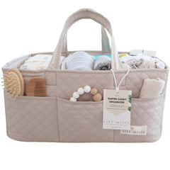 Lily Miles diaper caddy with quilted finish organizes newborn essentials at the changing station.