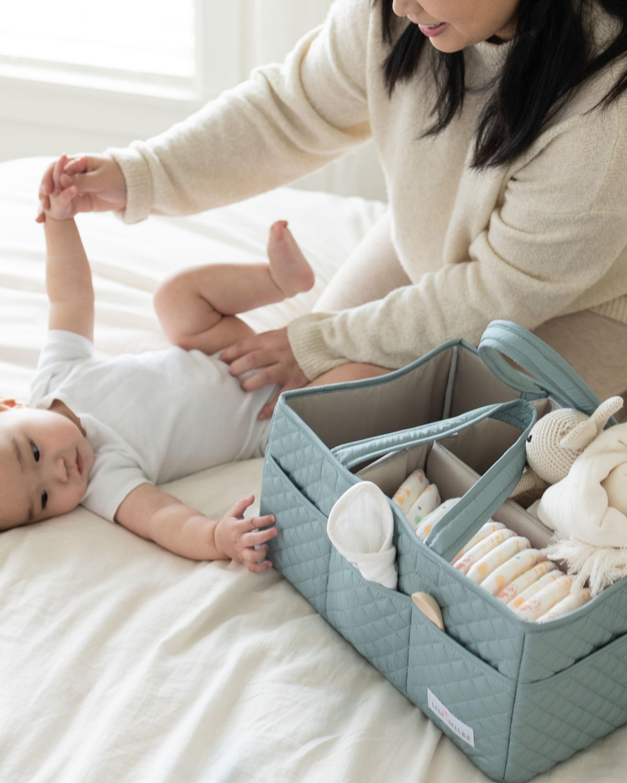 Lily Miles diaper caddy large capacity with dividers holds diapers, wipes, lotions, and toys.