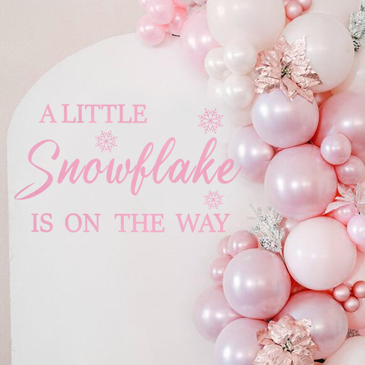 LINLULU A Little Snowflake Is On The Way decal creates a festive backdrop for memorable baby shower photos.
