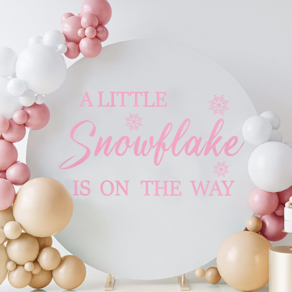 LINLULU Coordinating-winter-decor-snowflakes ties theme together for cohesive party styling.