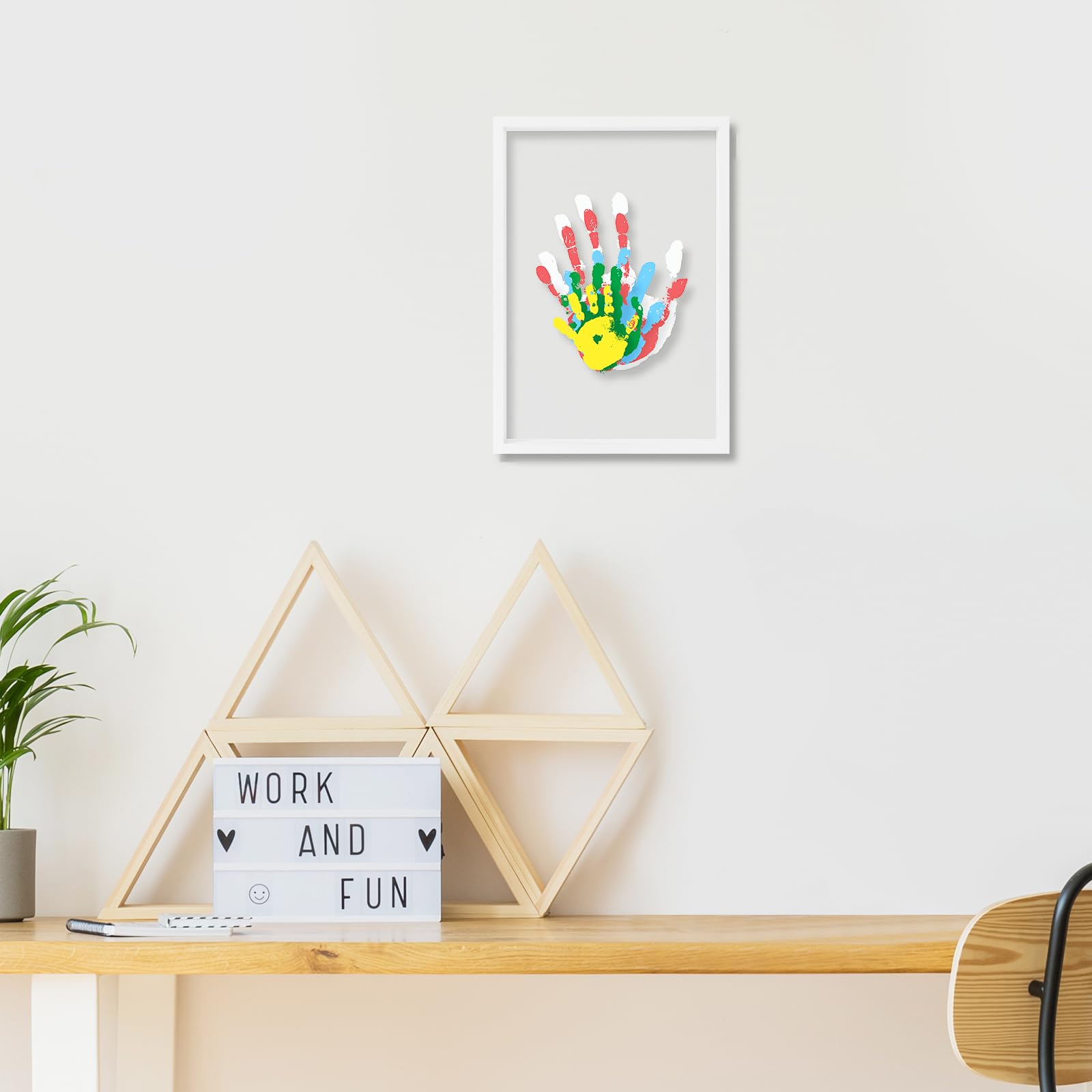 Liovsiso Baby handprint kit supplies in action capturing tiny footprints safely.