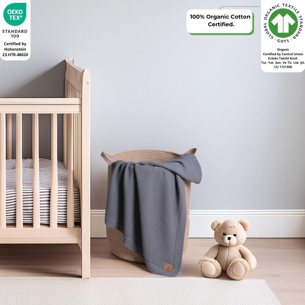 Little Dedi blanket stroller-cover draped for on-the-go warmth and breathability.