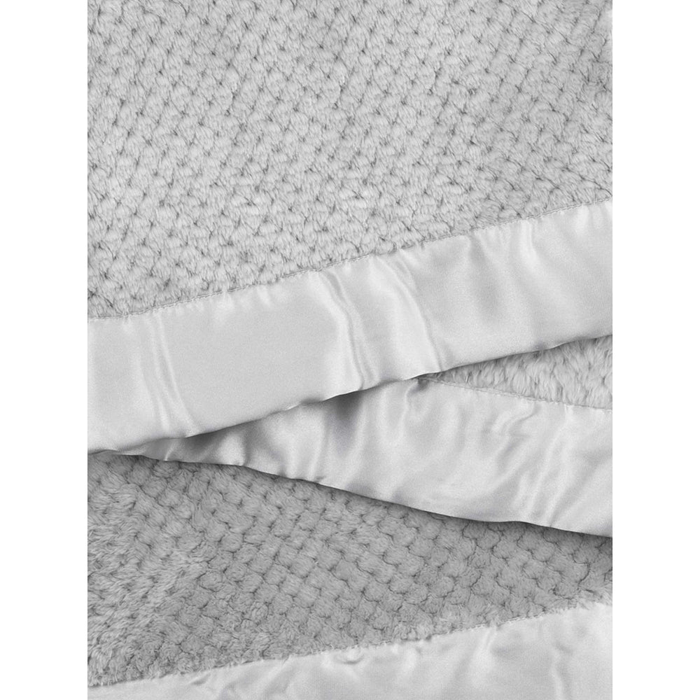 Little Giraffe Honeycomb Blanket draped over crib for chic nursery decor