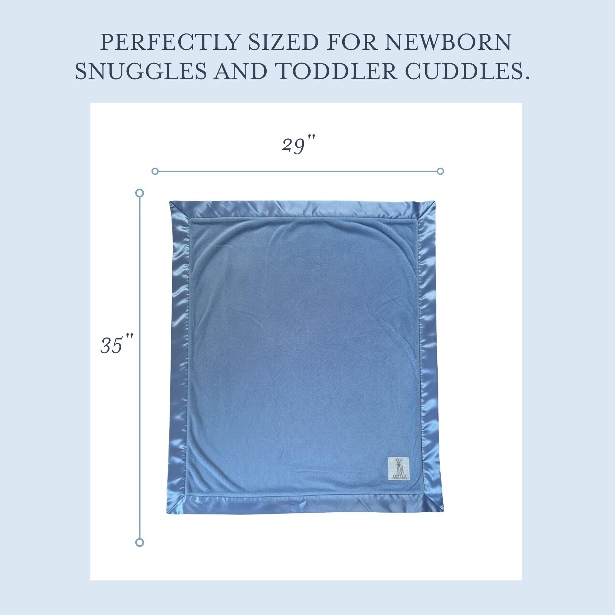 Little Giraffe Luxe baby blanket in nursery display with timeless cornflower hue