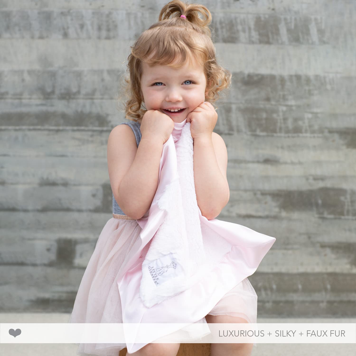 Little Giraffe Luxe mini blanky satin border detail highlighting refined baby touch.