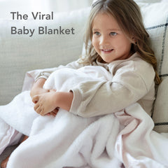 Little Giraffe Posh Mink blanket draped in chic nursery decor.