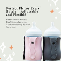 Baby holding bottle with Little Gripsters sleeve for confidence