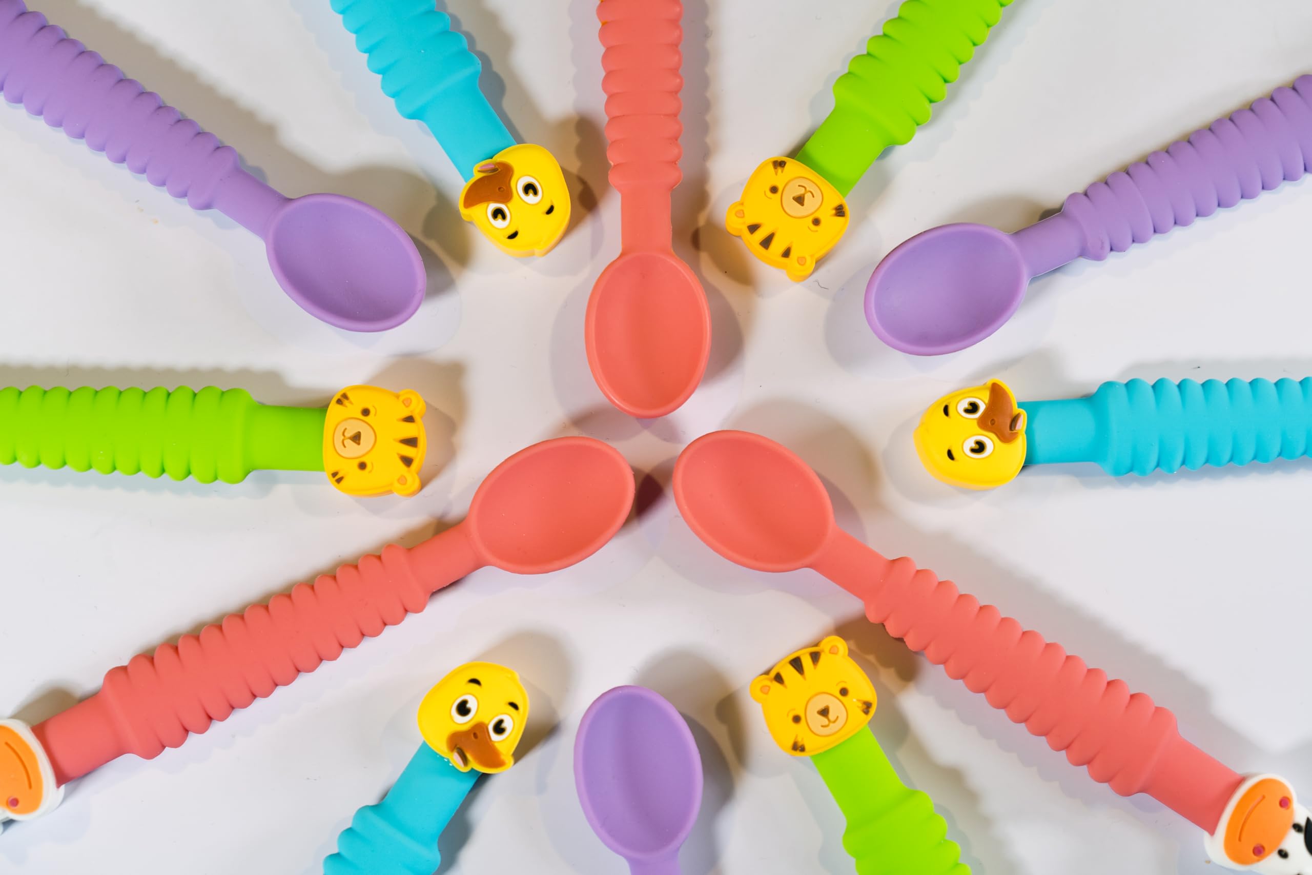 Little Grubbers baby-led weaning dining shot showing colorful duck and tiger designs.