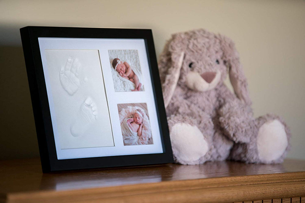 Little Hippo keepsake demonstrates pet-friendly use alongside baby handprints in a frame.