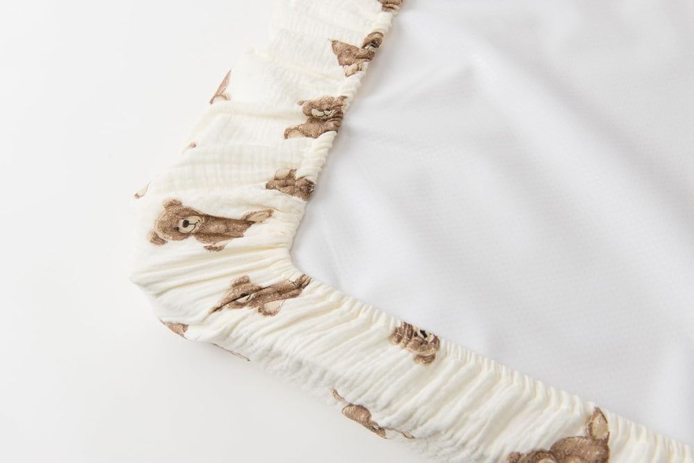 Little Jump boho teddy prints on changing pad cover for playful design.