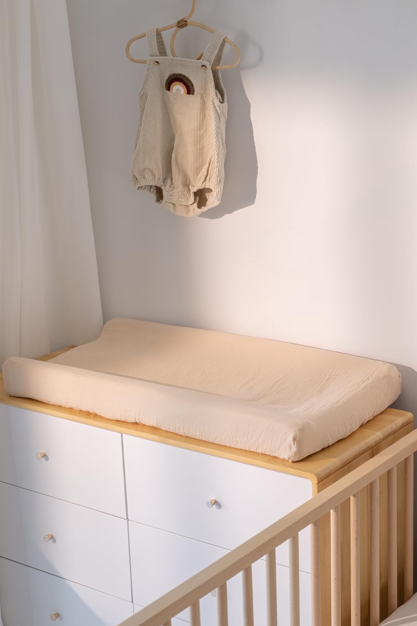 Little Jump machine-washable changing pad cover for easy care.