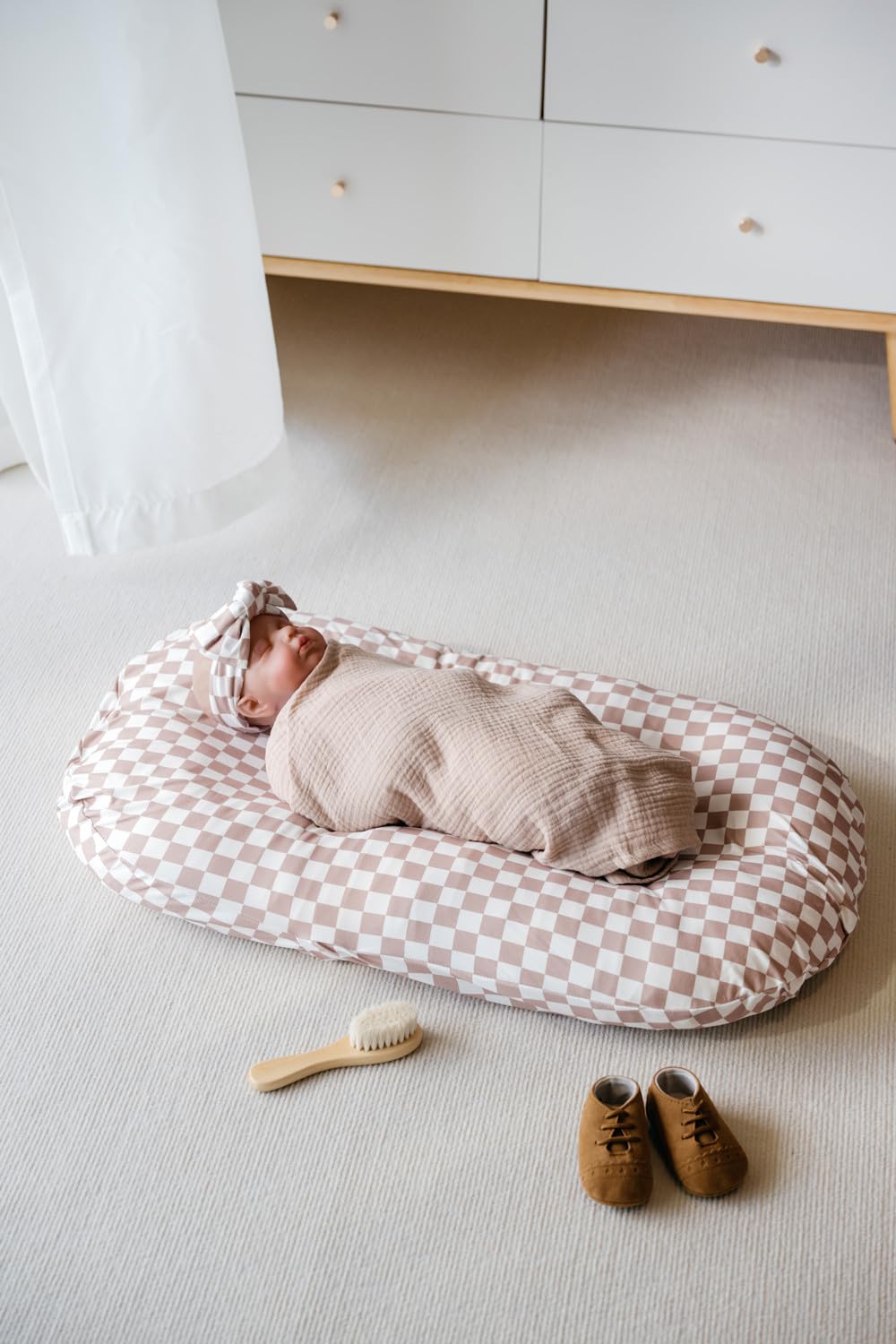 Little Jump coffee checkered cover shows soft stretch for a secure, comfy fit.