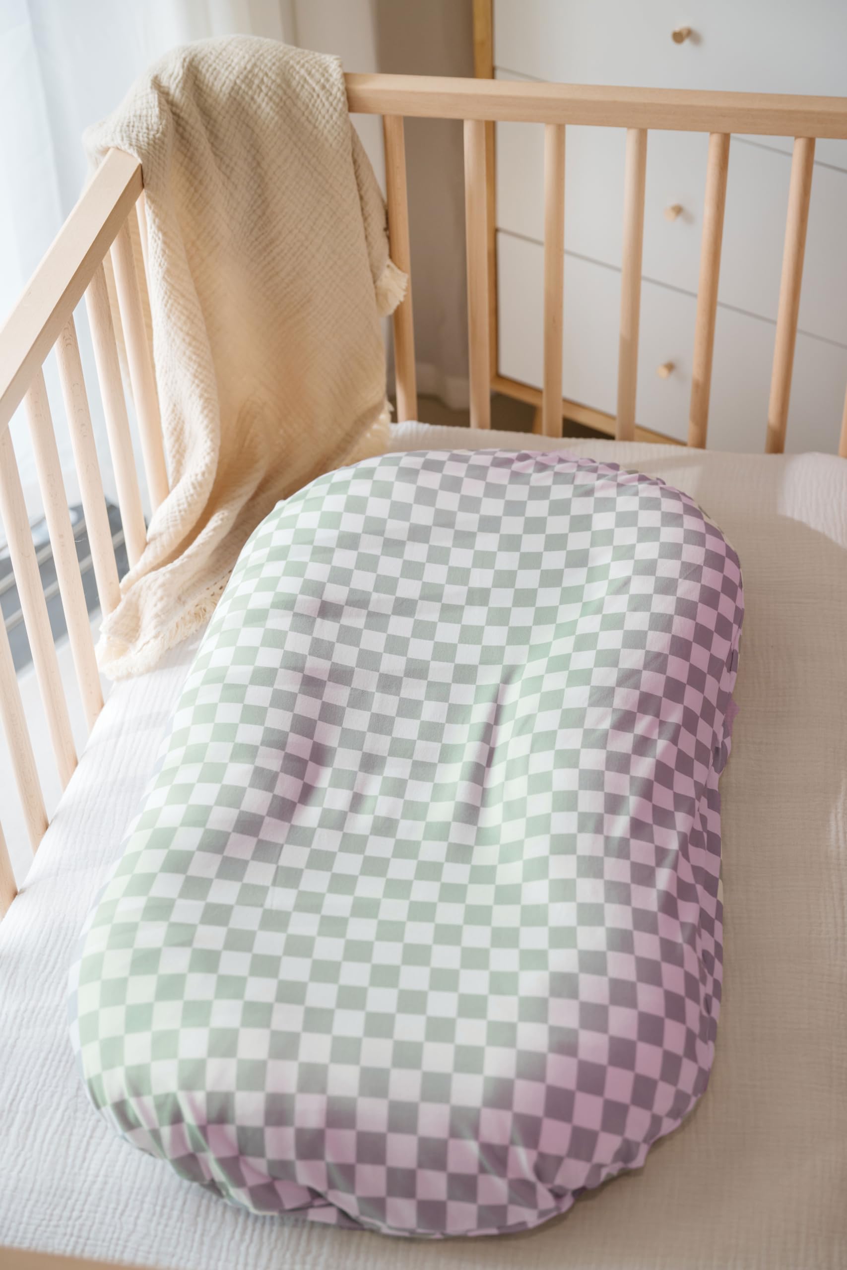 Little Jump green checkered cover in a nursery setting with easy care.