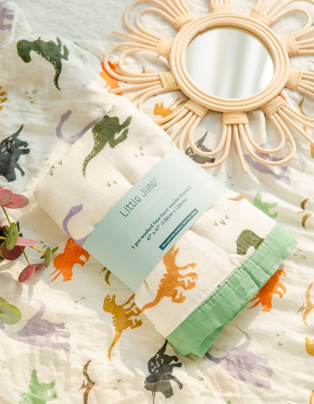 Little Jump dinosaur-print blanket adds cheerful style and practical use for travel and daycare.
