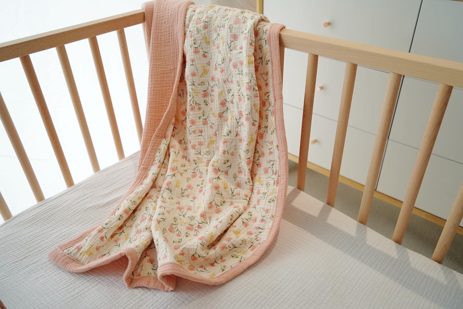 Little Jump muslin blanket crib bedding use demonstrates large 47x47 size for generous infant coverage.