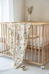 Little Jump muslin blanket close-up with soft tassels for nursery decor.