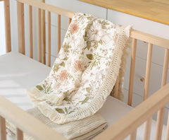 Little Jump swaddle featuring bear print used as newborn photo prop.