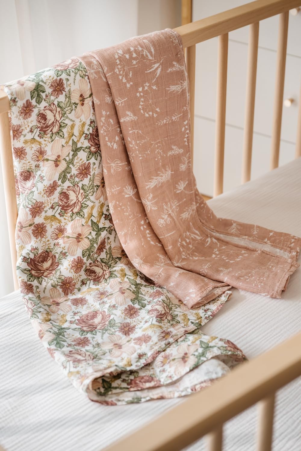 Little Jump swaddle laid flat in nursery to showcase size and coverage.