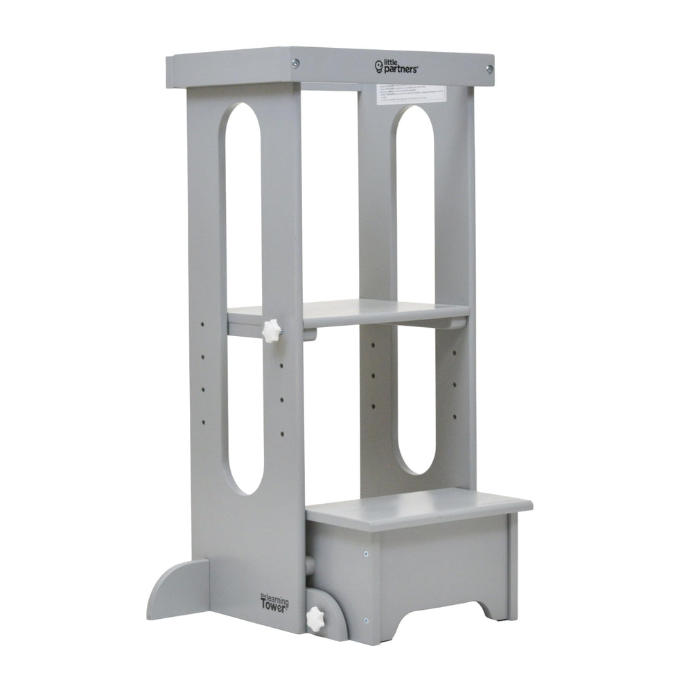 Little Partners Foldable Toddler Tower with wood construction supports safe kitchen exploration.