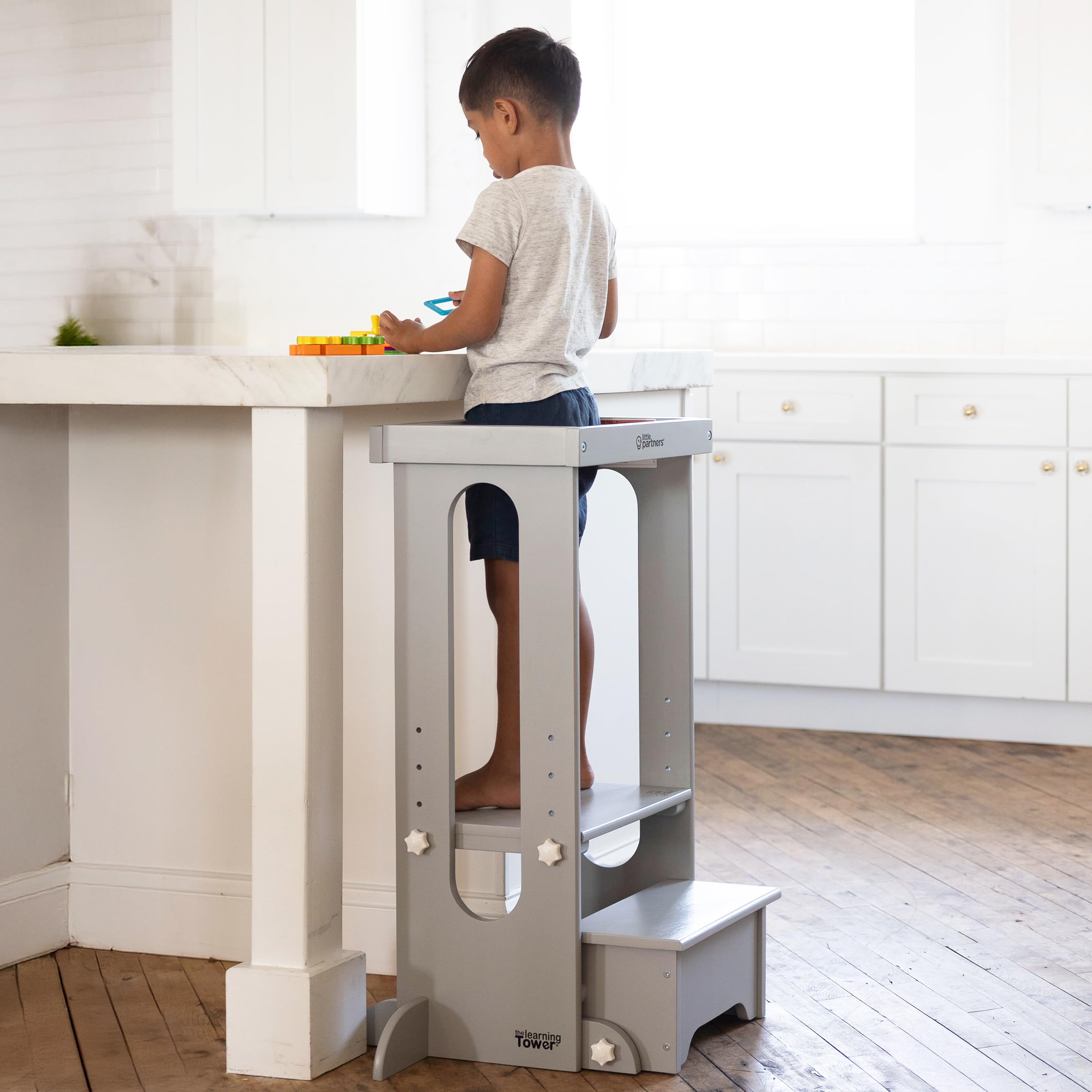 Little Partners Learning Tower kitchen setup demonstrates early independence with supervision.