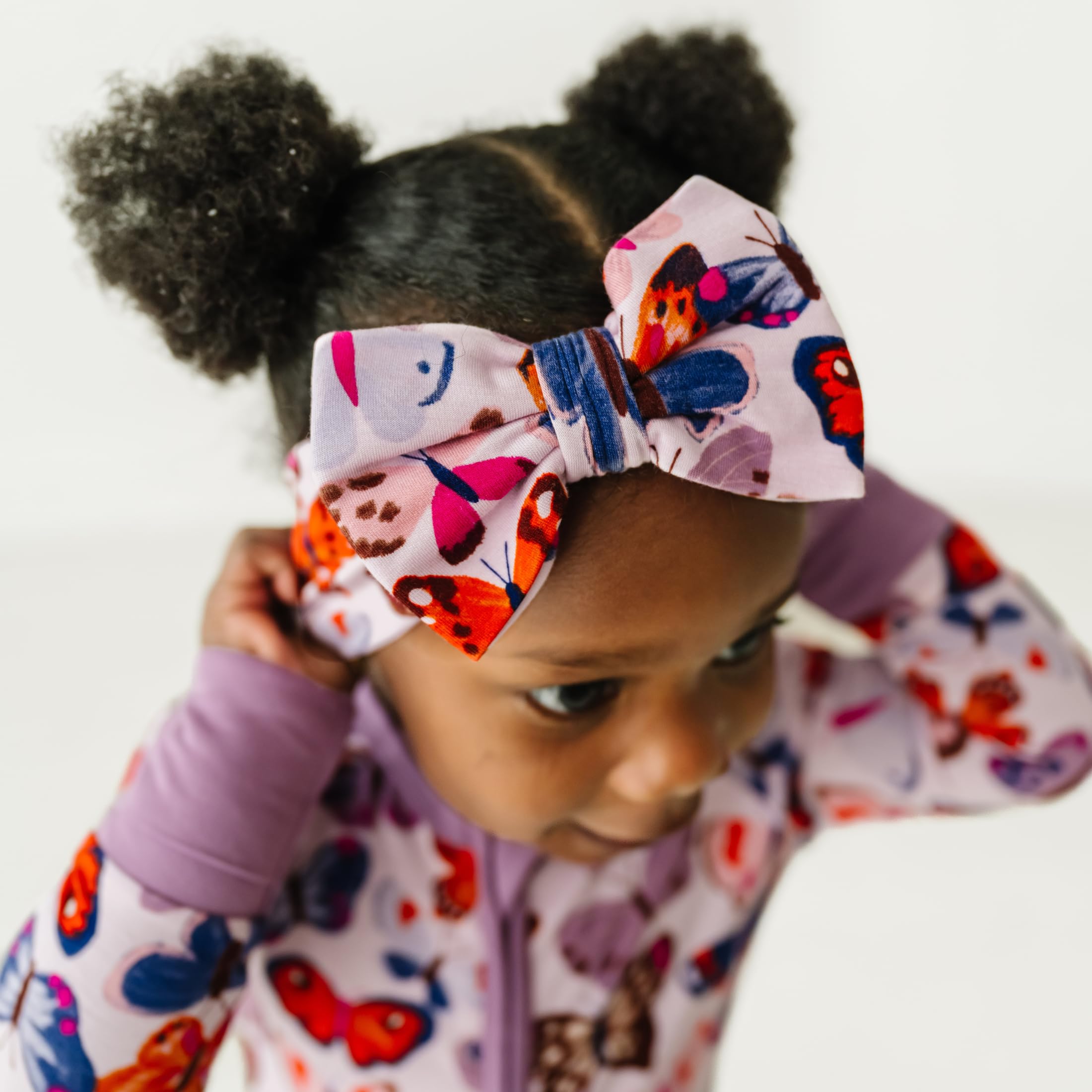Little Sleepies Luxe Bow Headband Butterfly Kisses coordinating collection enhances photo-worthy outfits.