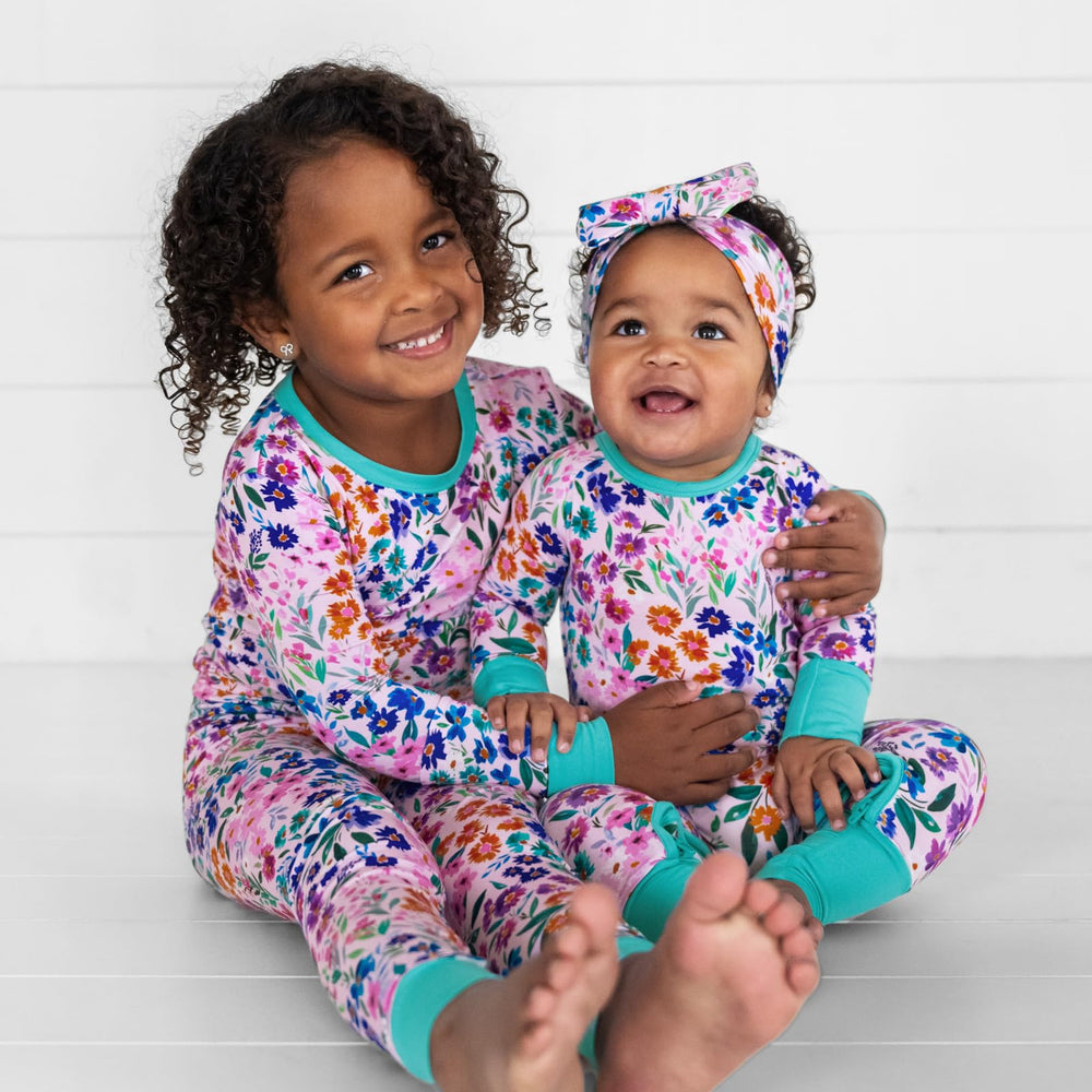 Little Sleepies Luxe Bow Headband Sweet Pea paired with Zippies for coordinated outfits.