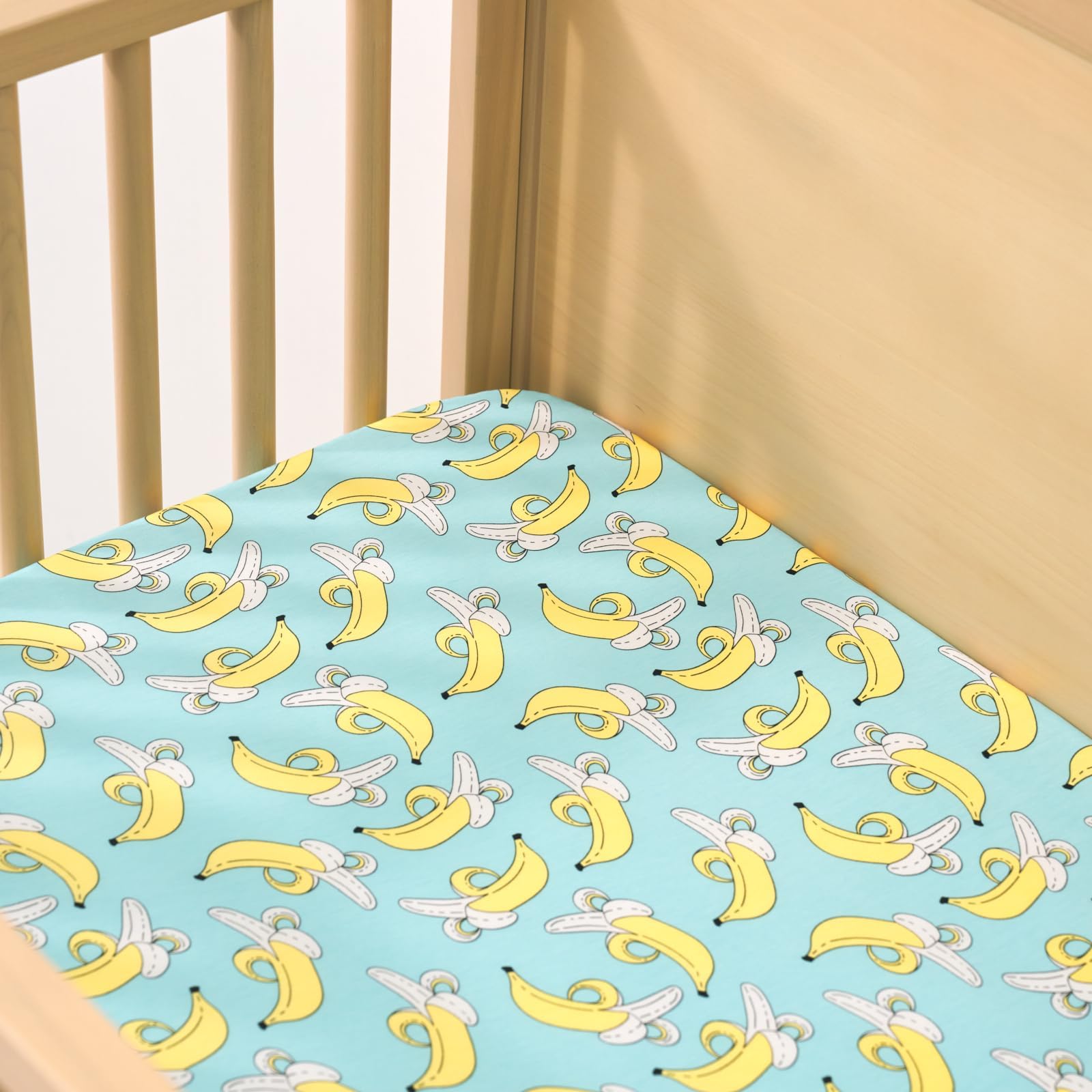 Little Sleepies Sunshine print sheet in nursery setting showcasing breathable bamboo fabric