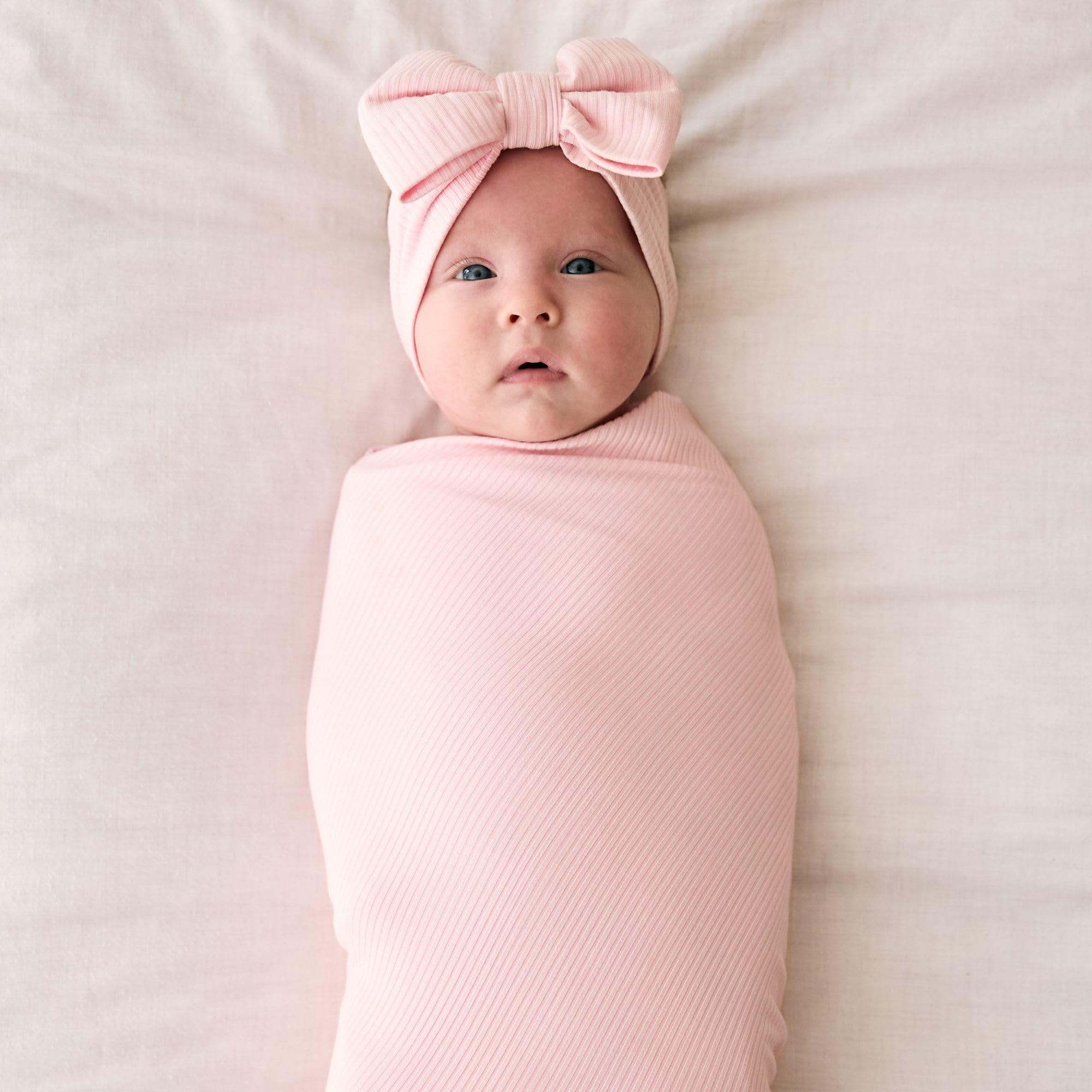 Little Sleepies swaddle Prima Pink used as nursing wrap for on-the-go feeding