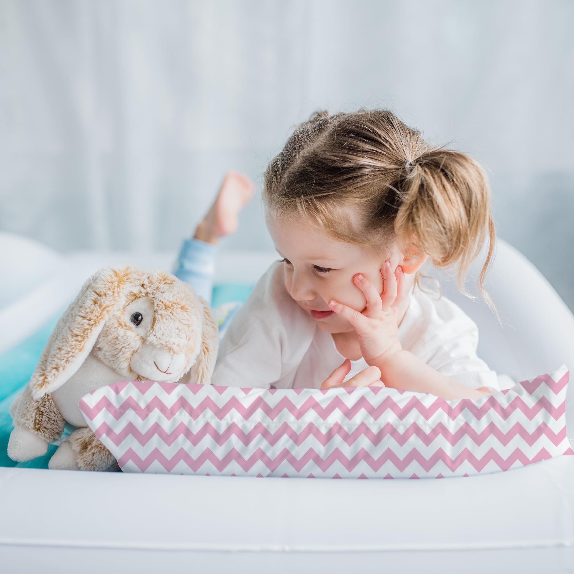 Little Sleepy Head pillow used during travel nap time as a compact companion.