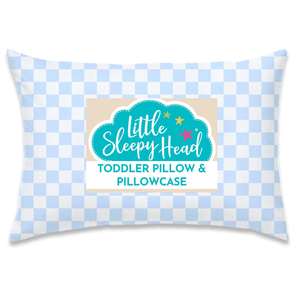 Little Sleepy Head toddler pillow with checkers baby blue on bed for comfy naps