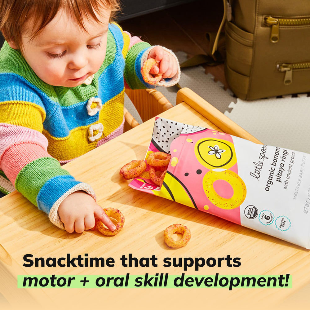 Little Spoon Banana Pitaya Meltable Baby Puffs four-pack display offers convenient snacks.