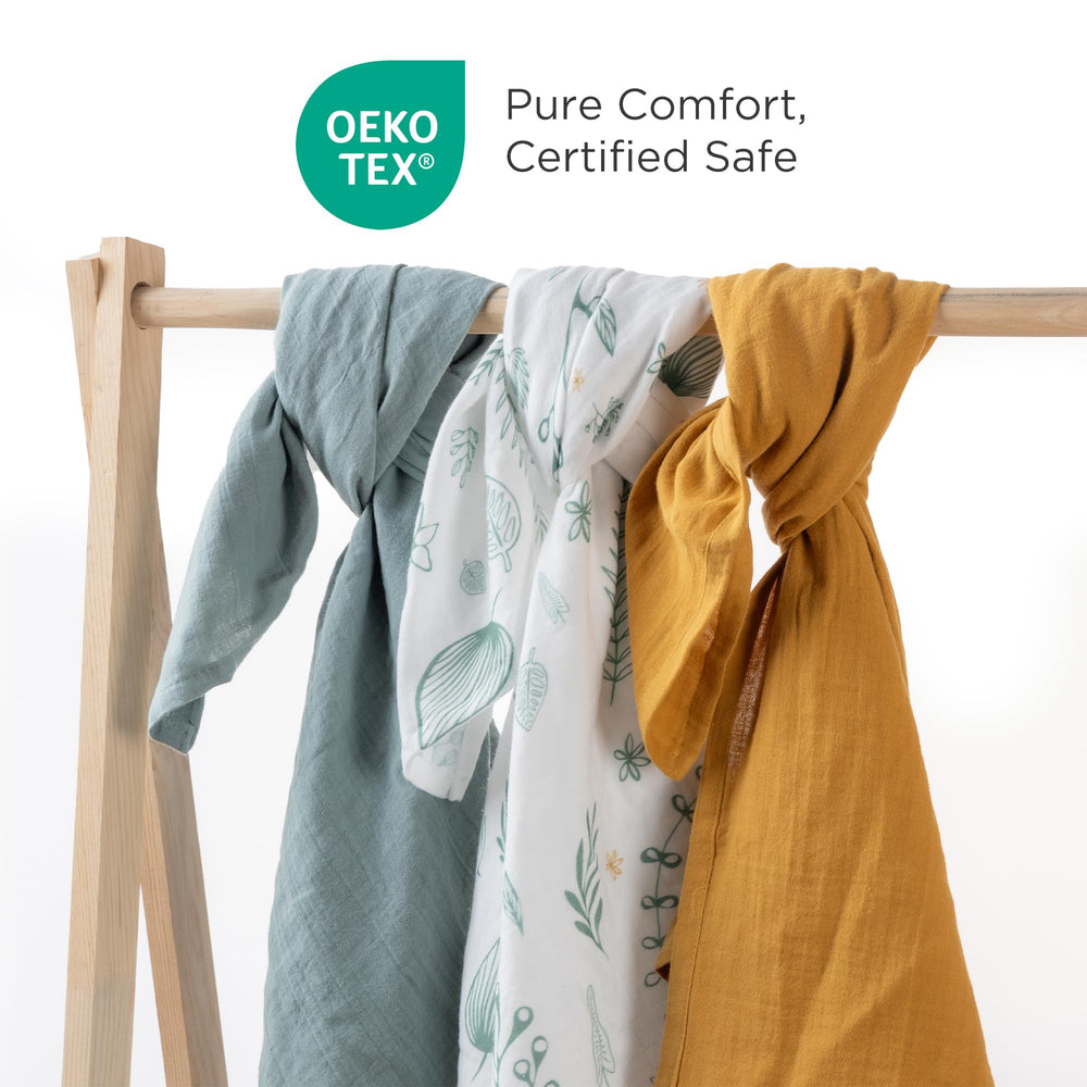 Little Triplets neutral-design swaddle blanket in a modern nursery.