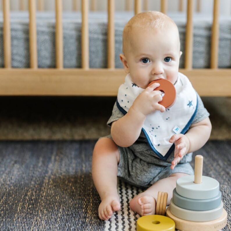 Little Unicorn bandana bib muslin texture emphasizes softness and absorption.