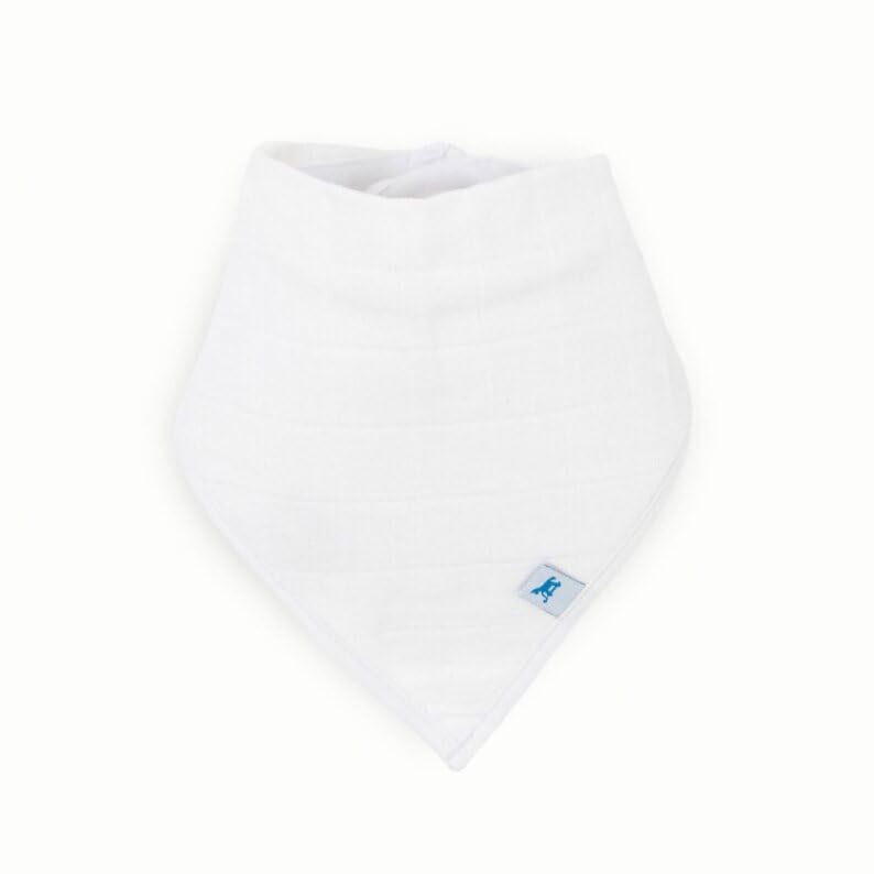 Little Unicorn white bib on a teething baby for drool control.