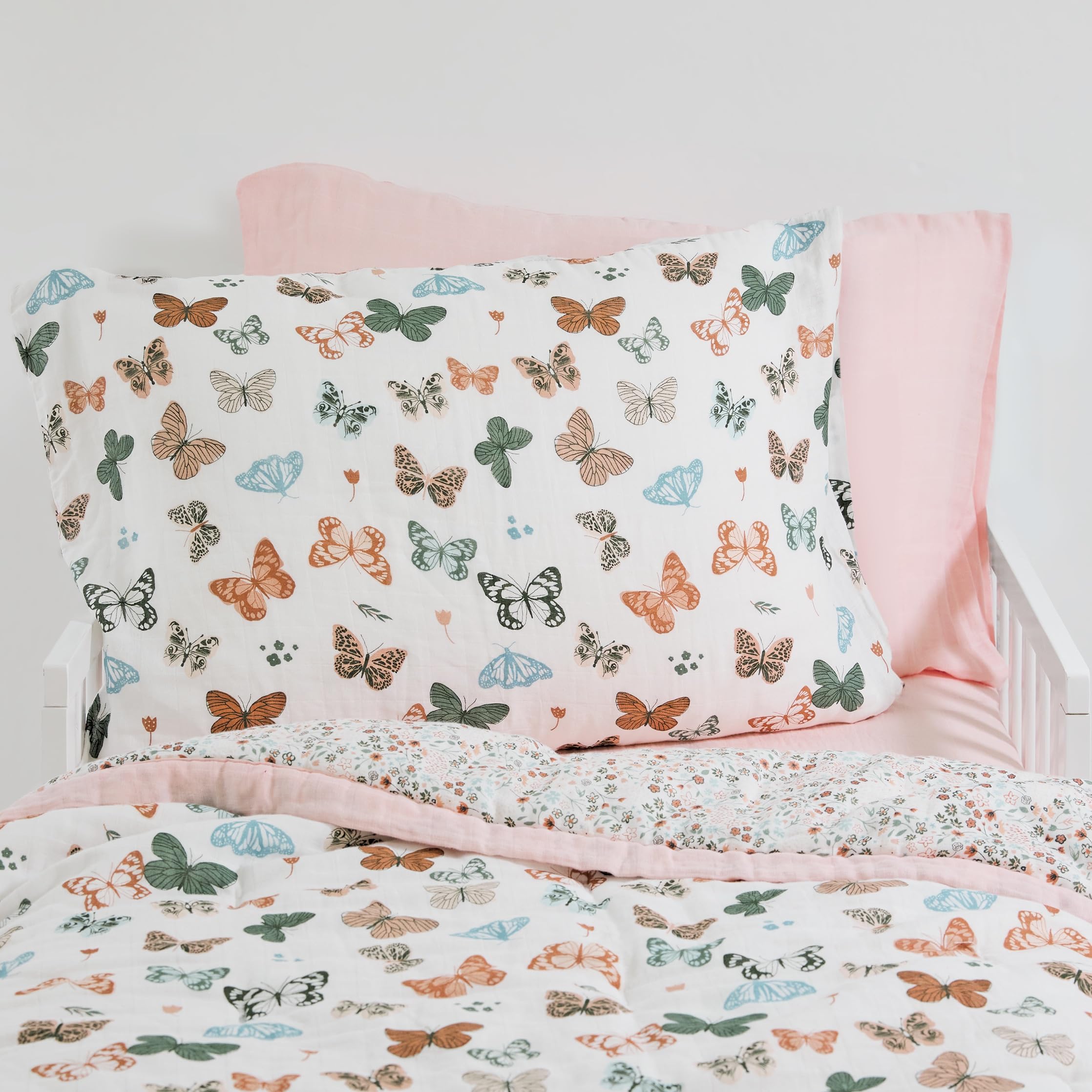 Little Unicorn butterflies 2-pack pillowcase closeup shows soft muslin texture.