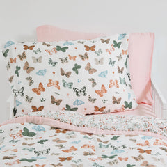 Little Unicorn butterflies 2-pack pillowcase closeup shows soft muslin texture.