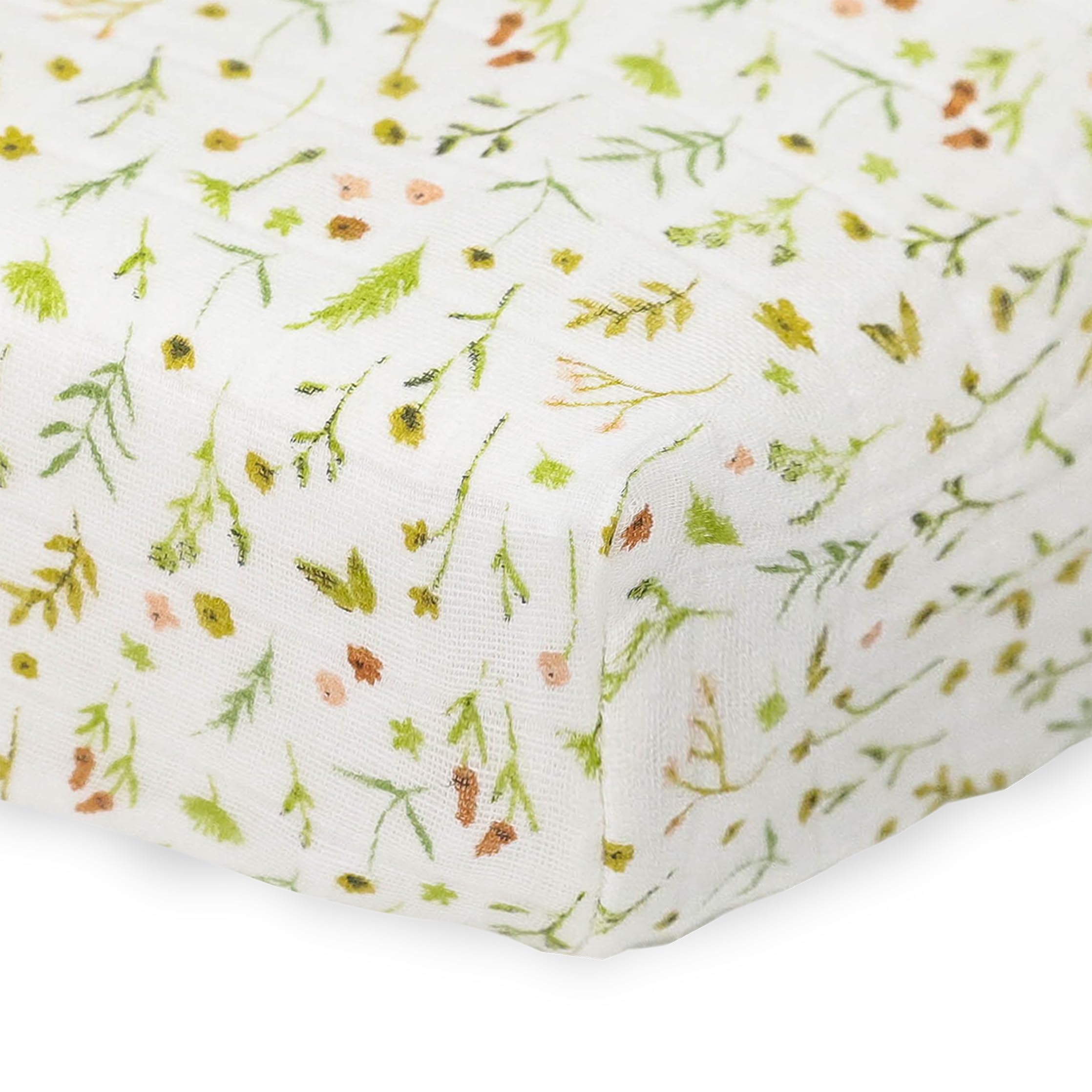 Little Unicorn changing pad cover Floral Field on changing pad shows snug elastic edge.