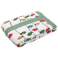 Little Unicorn cotton muslin quilt with hand-painted prints delivers breathable warmth for naps.