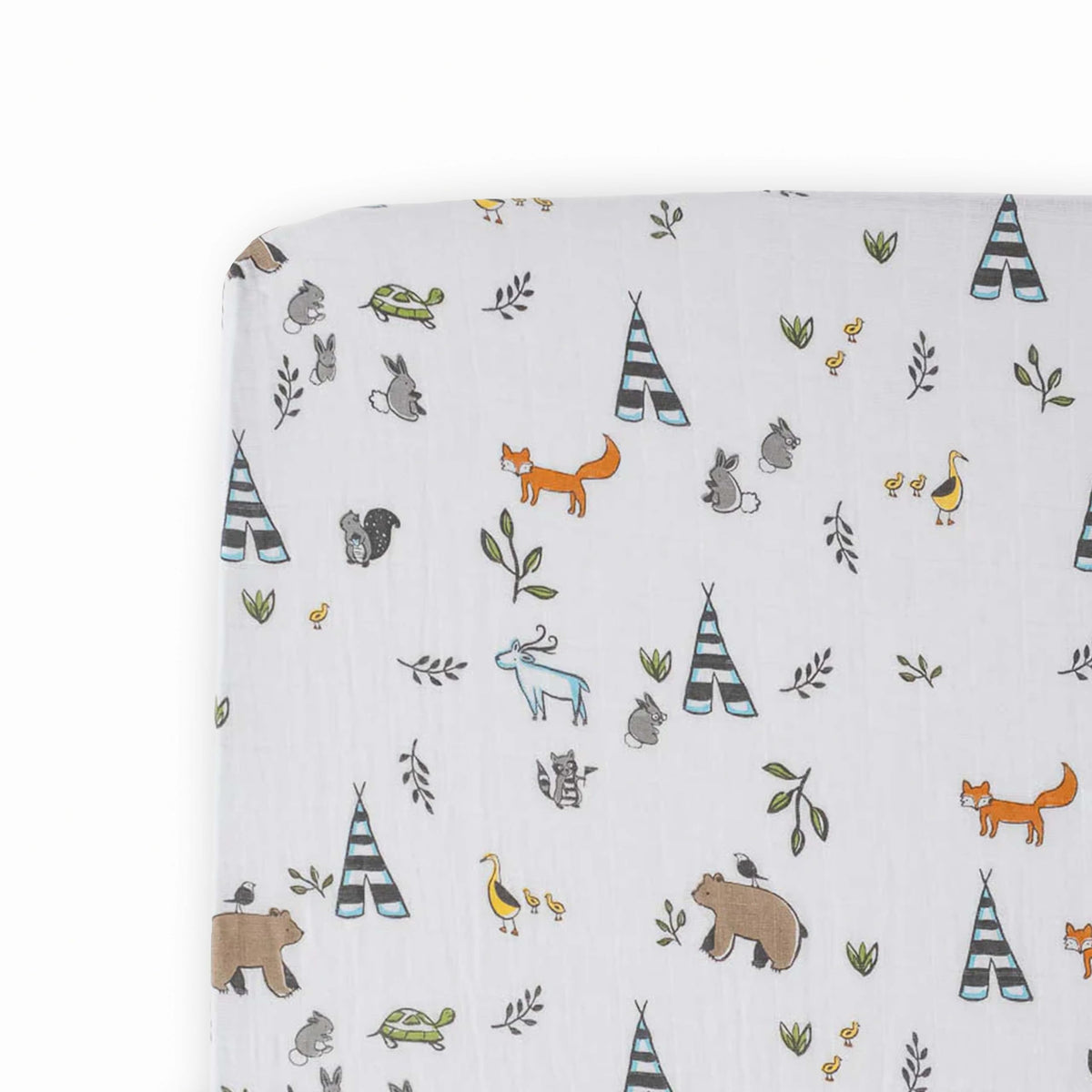 Little Unicorn Forest Friends crib sheet folded showing premium muslin softness for easy setup.