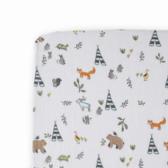 Little Unicorn Forest Friends crib sheet folded showing premium muslin softness for easy setup.
