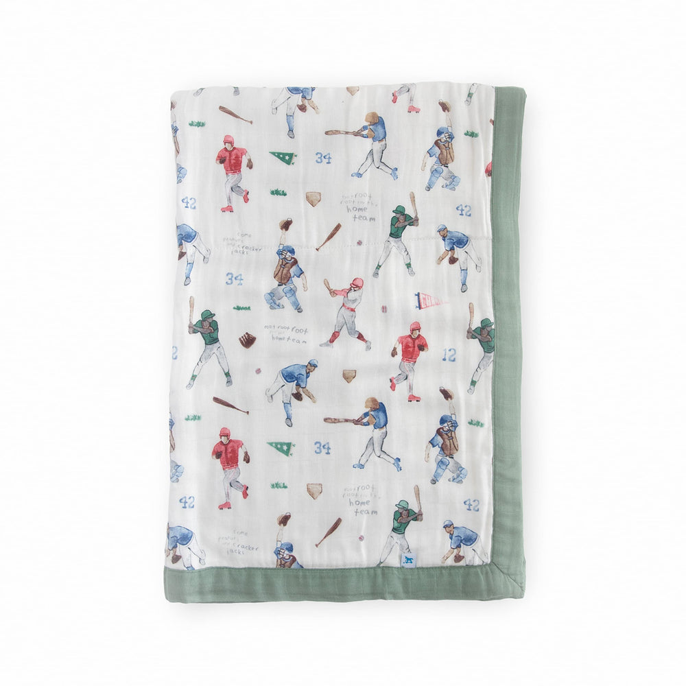 Little Unicorn Deluxe Muslin Quilt baby snuggle close-up showing silky-soft bamboo rayon.