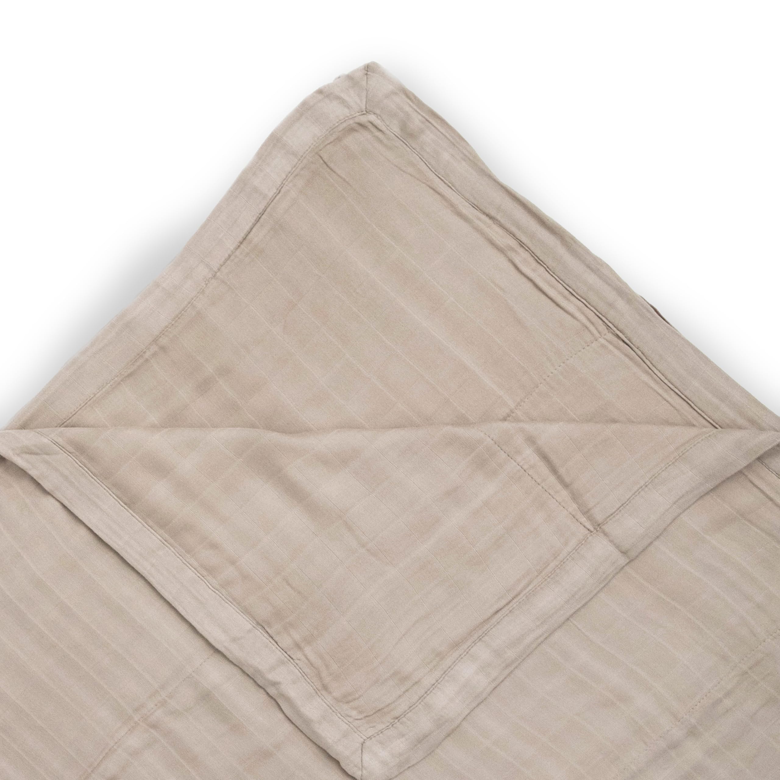 Little Unicorn Deluxe Muslin Quilt used for baby snuggle moments.