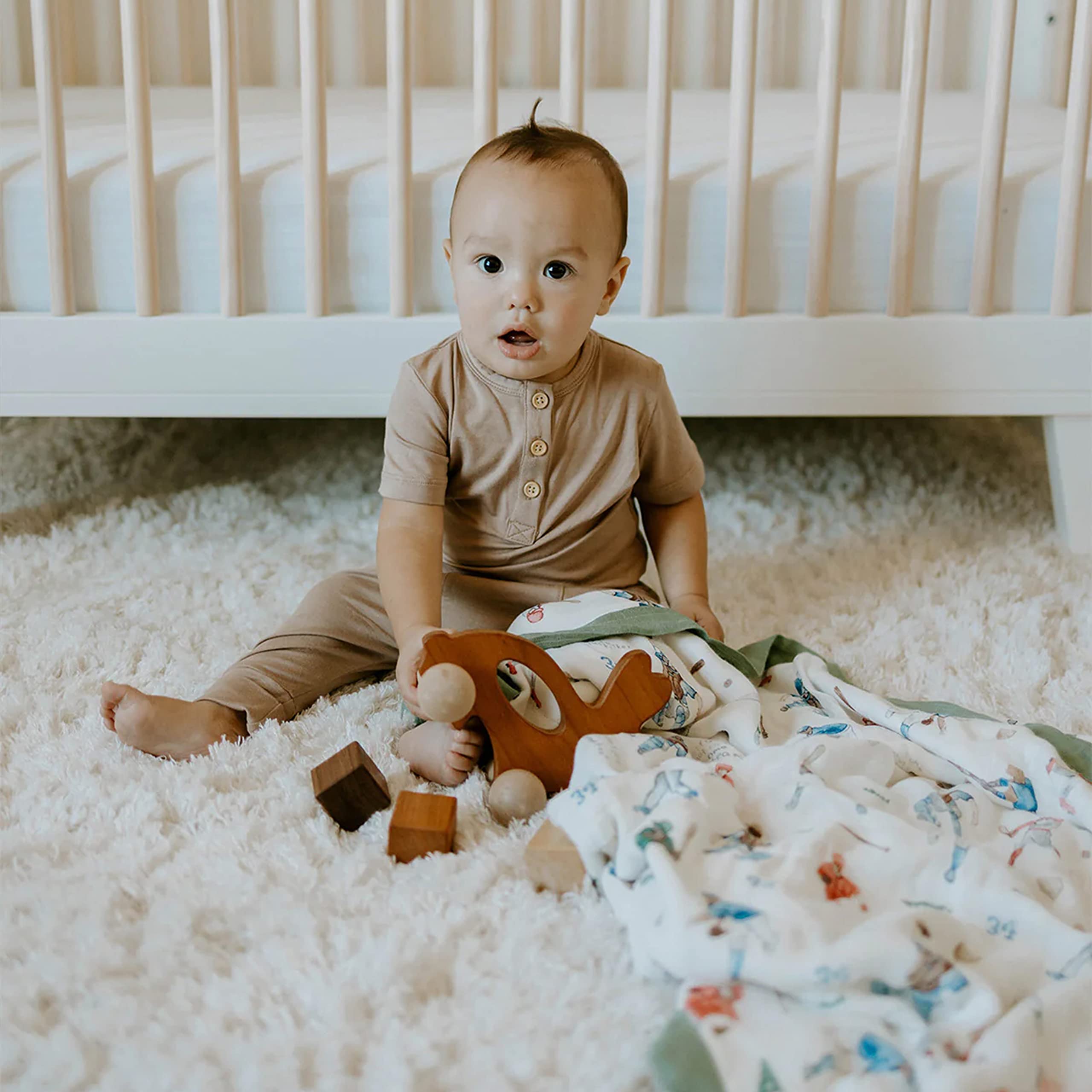 Little Unicorn Deluxe Muslin Quilt soft texture banner illustrating comfort for babies.