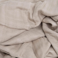 Little Unicorn Deluxe Muslin Quilt in stroller for on-the-go warmth.