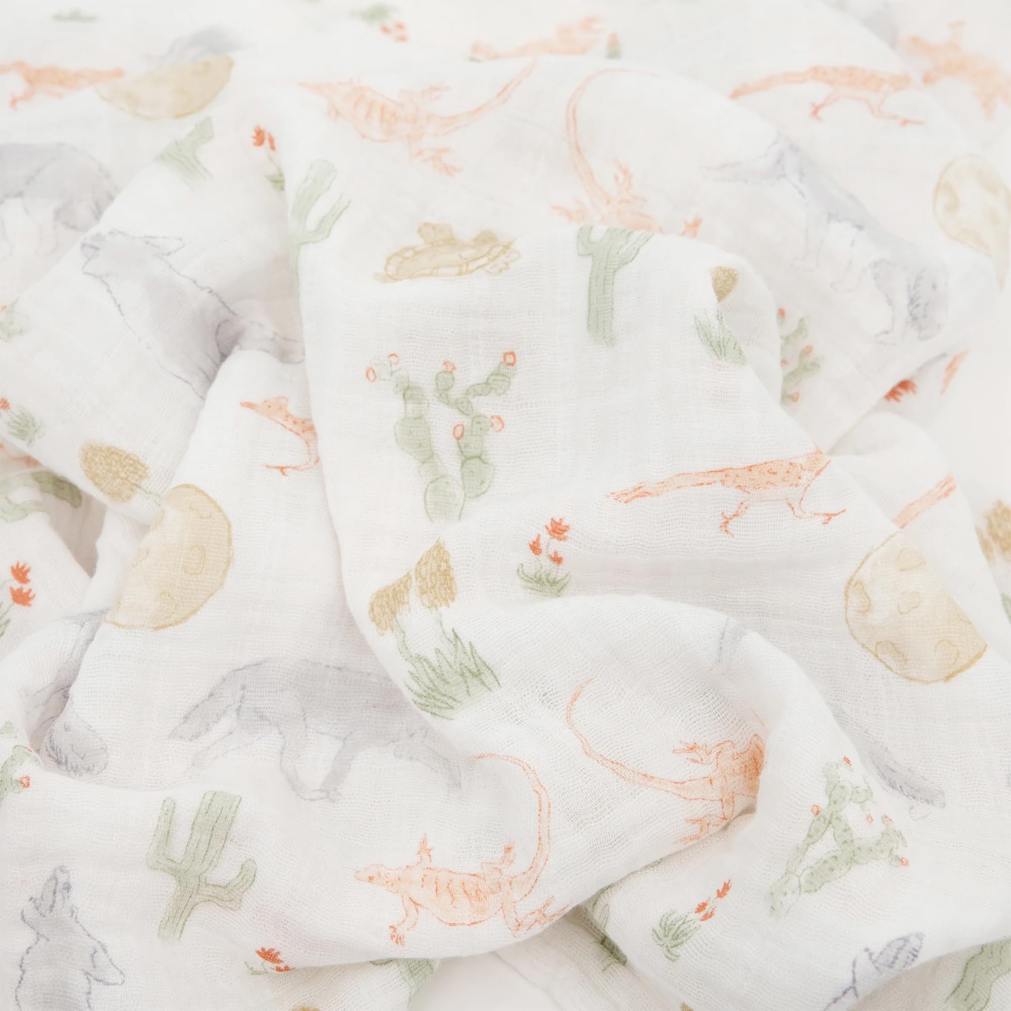Little Unicorn Desert Night swaddle folded for compact travel and storage.