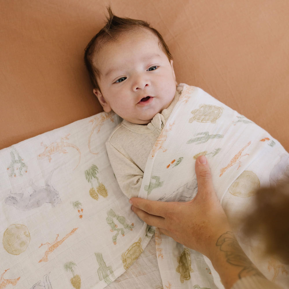 Little Unicorn Desert Night swaddle gift-ready packaging for new parents.