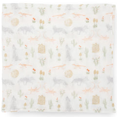 Little Unicorn Desert Night swaddle used for nursing setup and easy access.