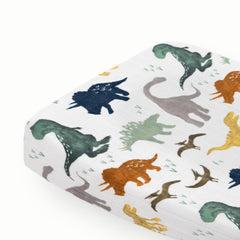 Little Unicorn Dino Friends changing pad cover front view shows soft muslin for baby comfort.
