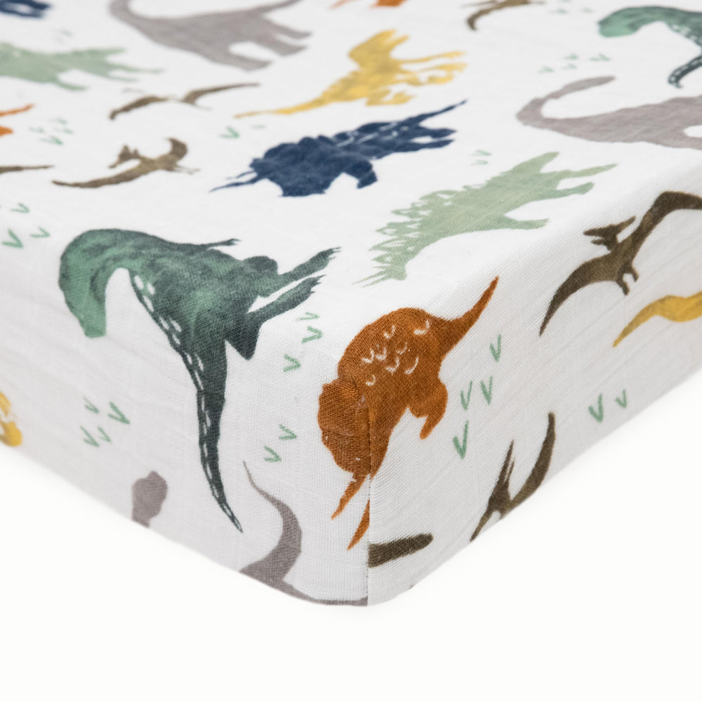 Little Unicorn Dino Friends changing pad cover pattern close-up highlights colorfast print.